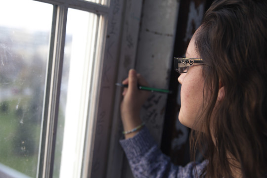 Jenni Sefcik picks a place to sign her name.