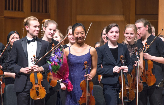 Senior Sophie Yang receives a standing ovation for her solo work in “Concerto for Violin in D minor, Allegro moderato,” by Sibelius. Photo by Veronica Bella