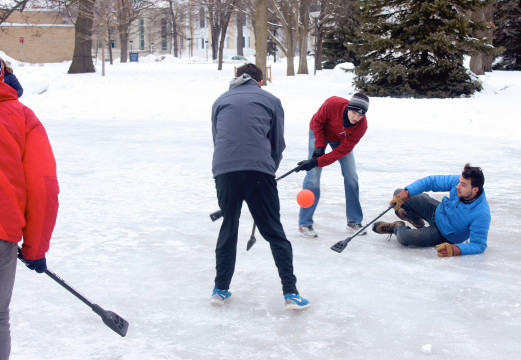 Students playing the ice sport broomball on the ice rink outside Ormsby Hall. Photo by Sadie Tenpas