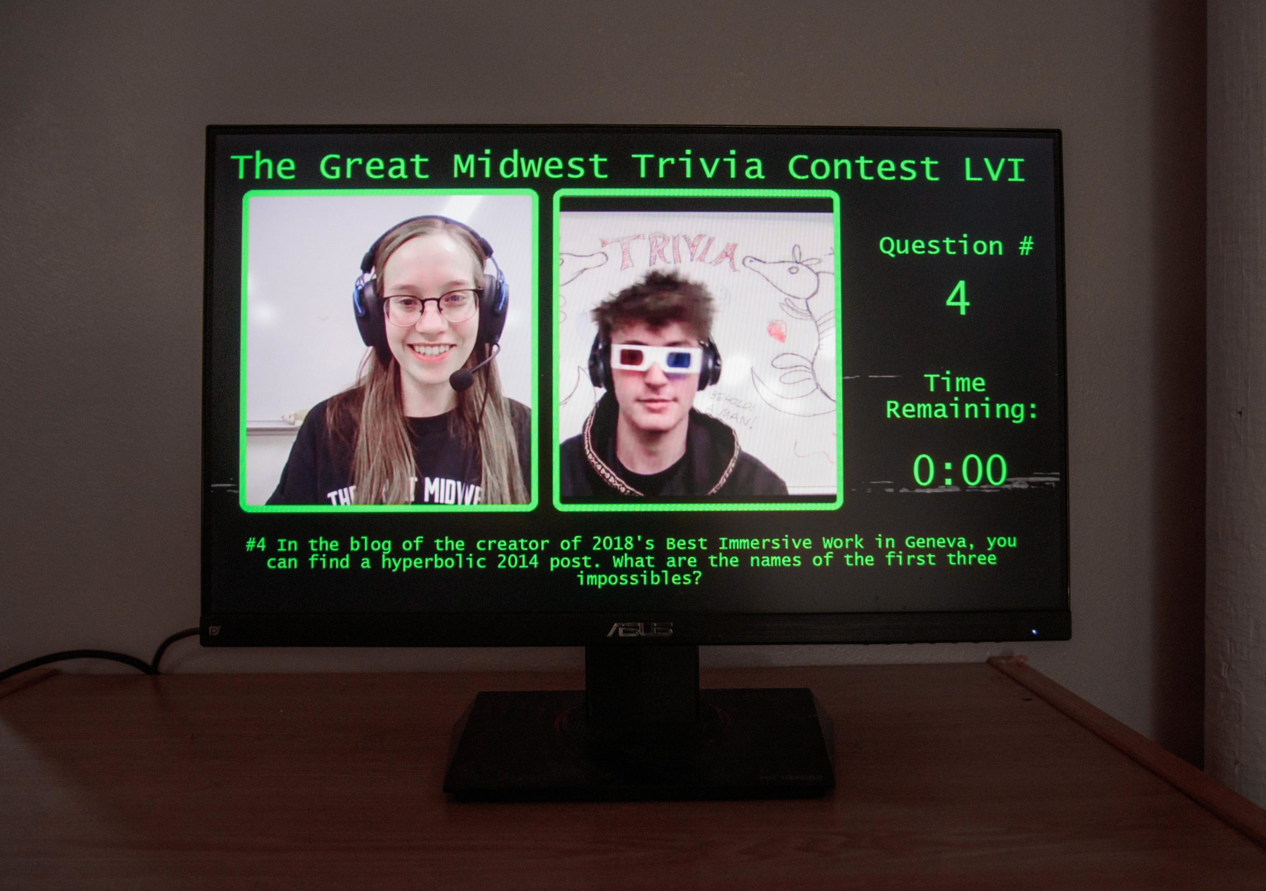 Computer screen displaying two people and information about contest